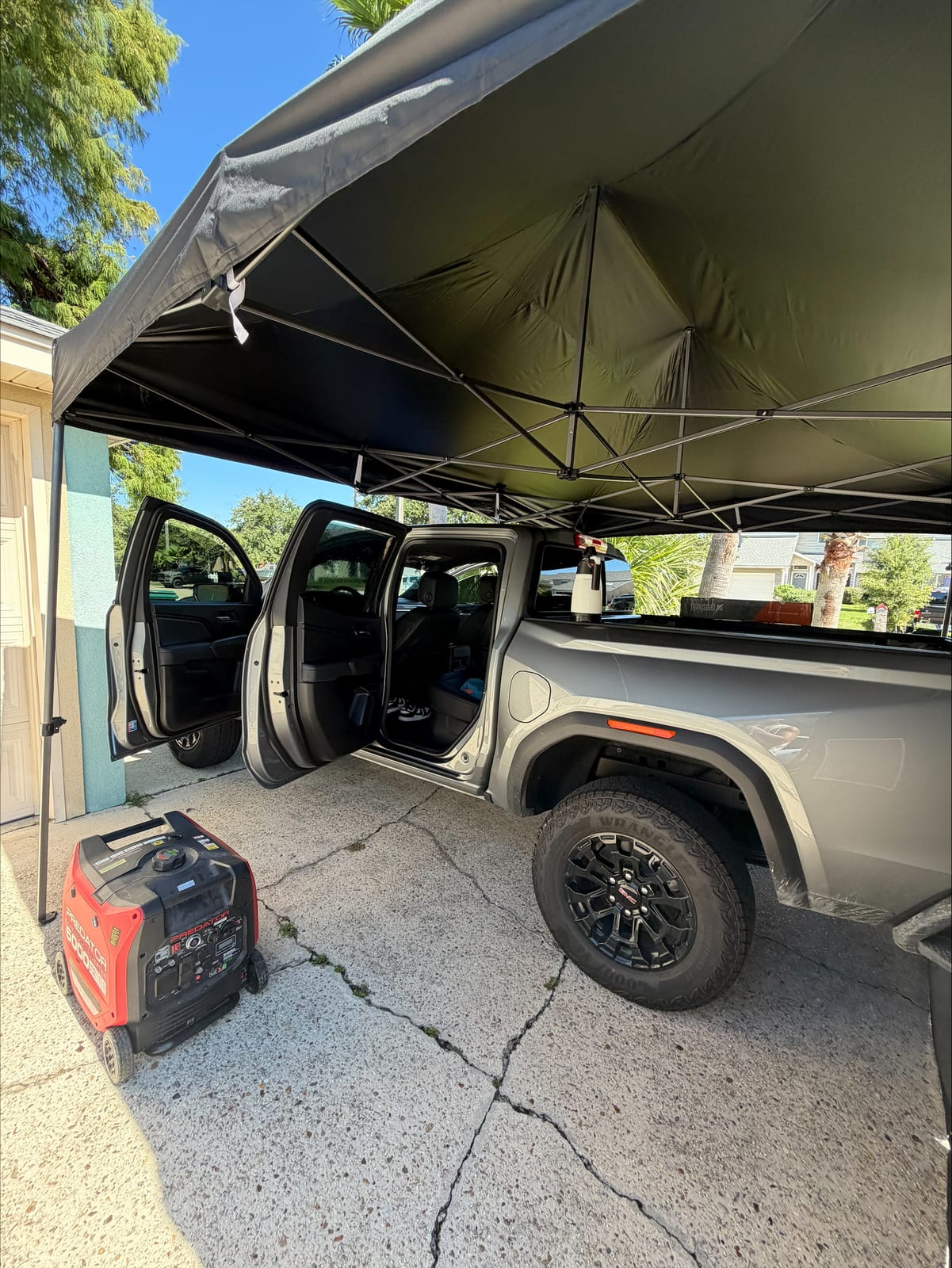 The Tint Guys mobile service setup with canopy and generator